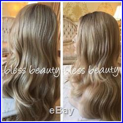 Layered ash blonde wavy lace front wig. Human Hair Blend. Brown Root